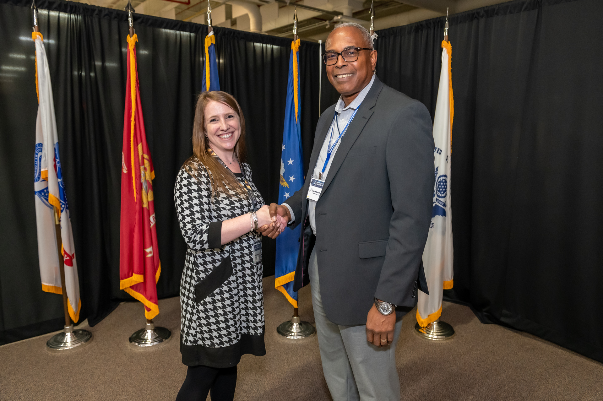 Photo of Katlin Edmunds shaking hands 