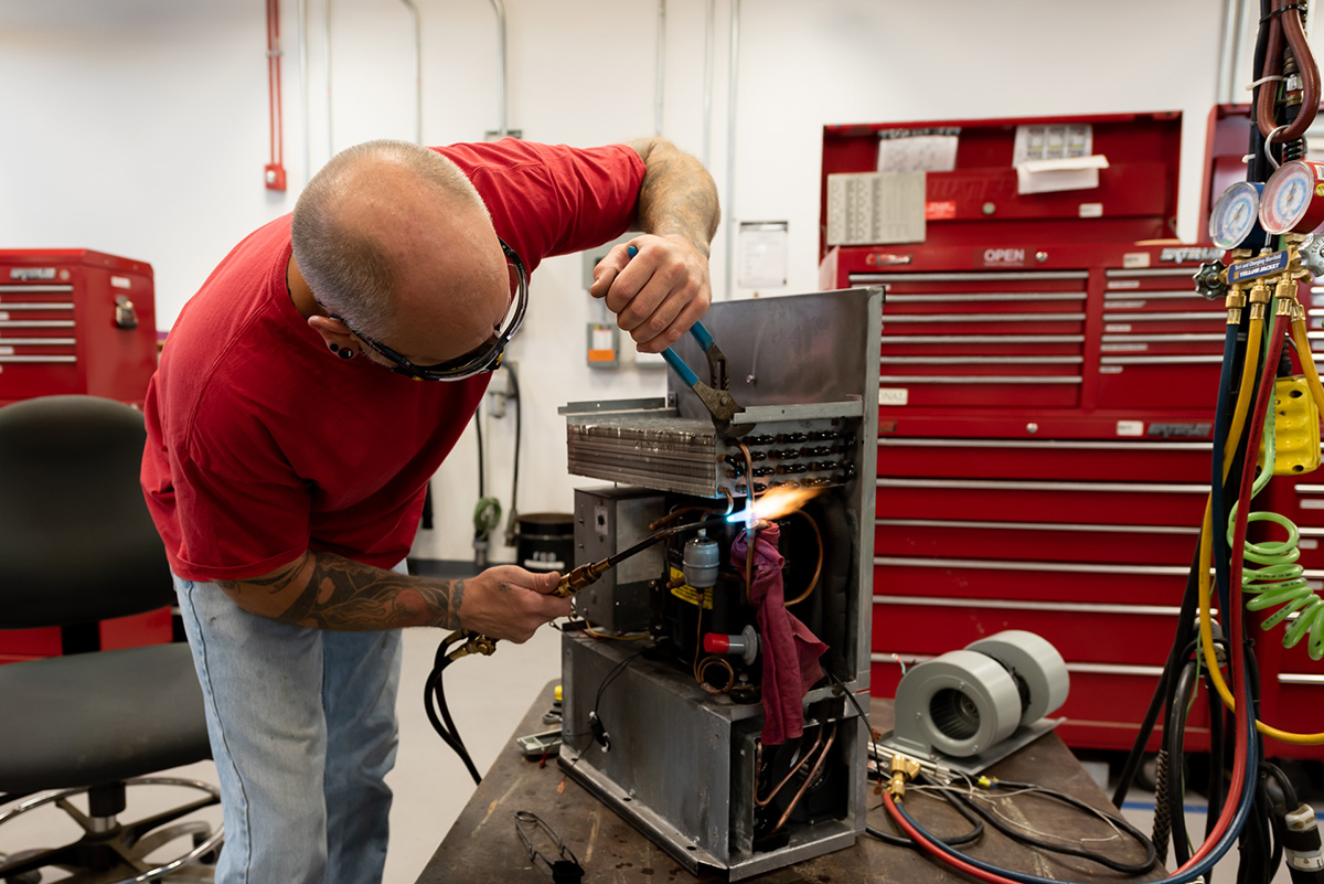 Photo of employee working on a ECU 