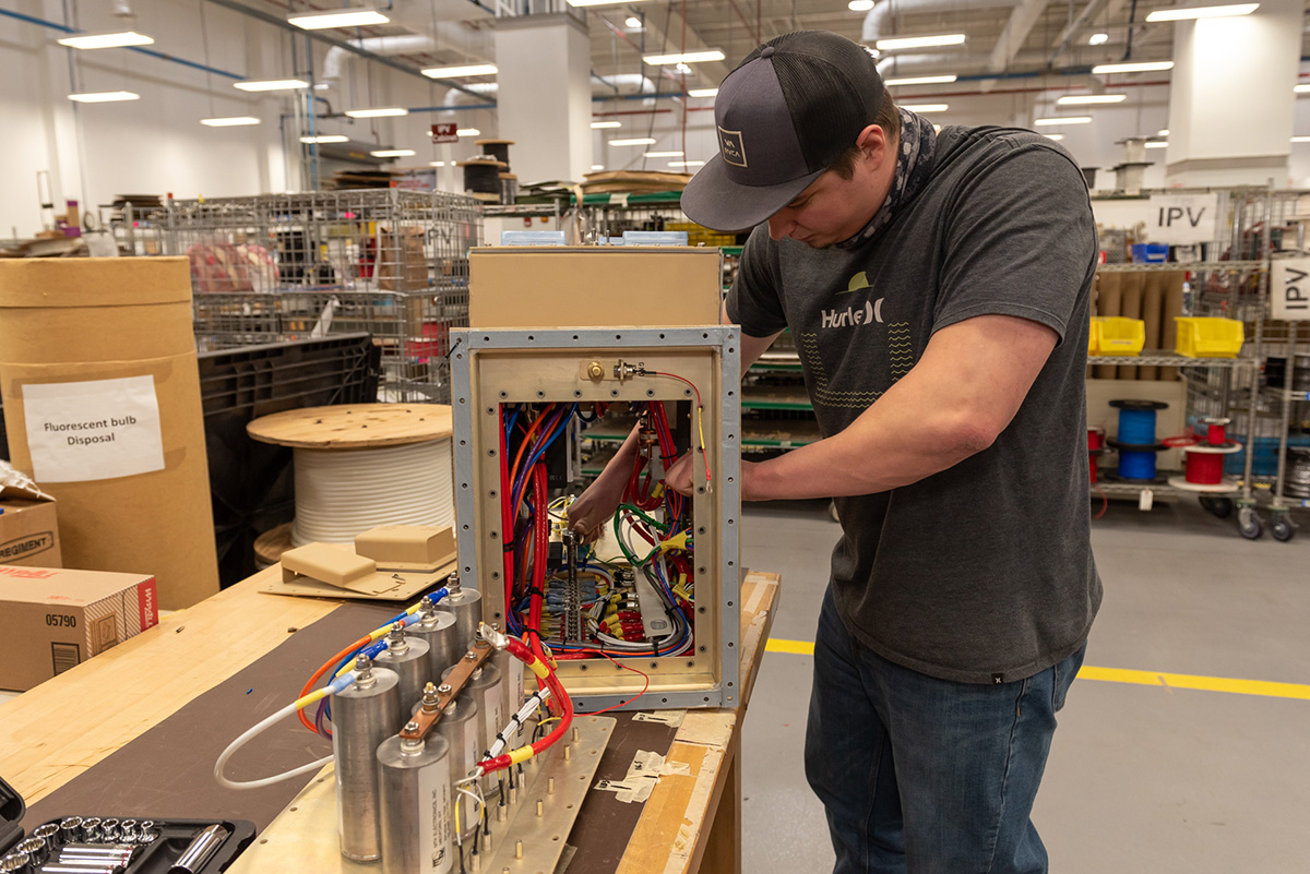 Photo of person working on cable
