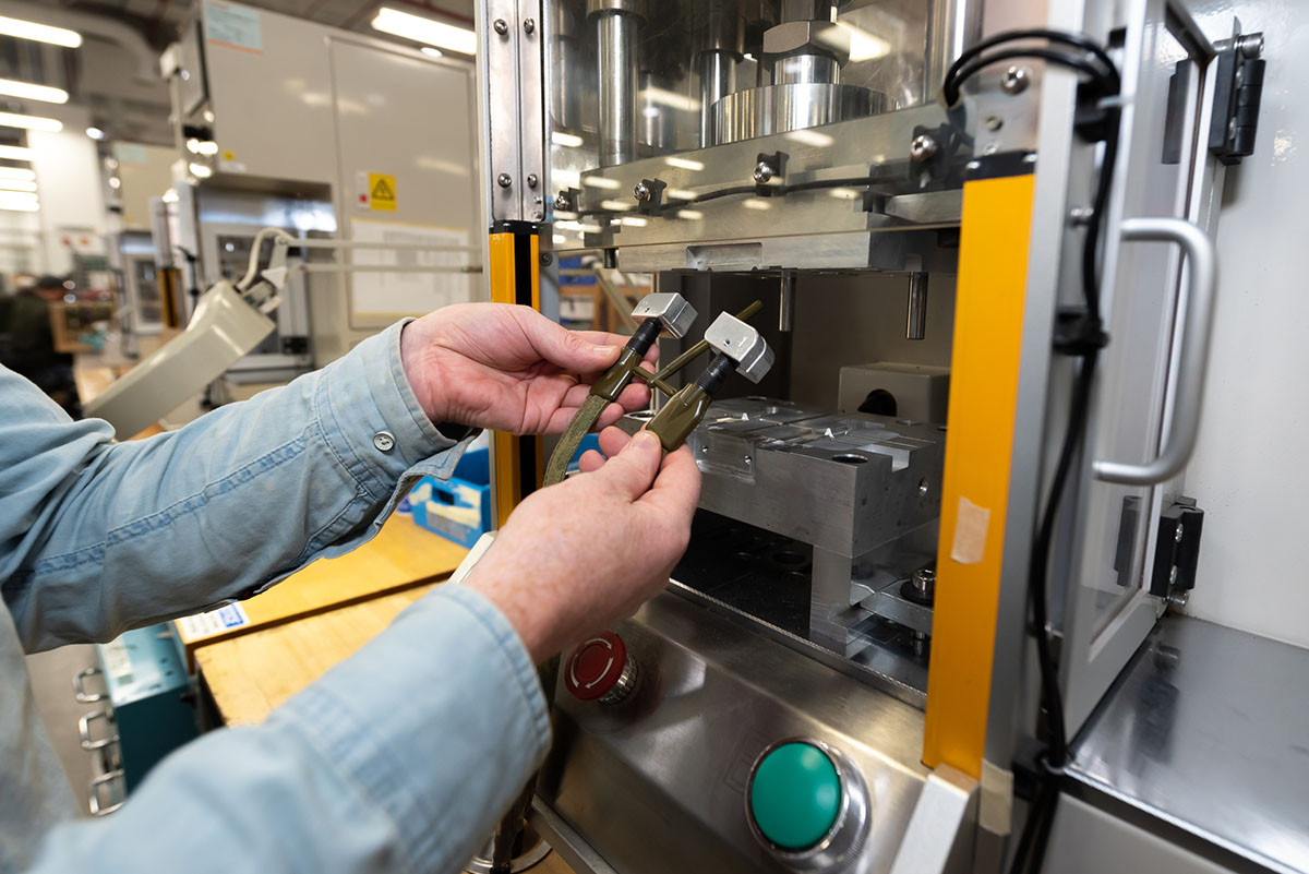 Photo of person working on cable 